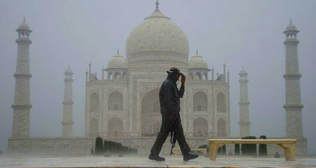 Iconic Taj Mahal stands tall amidst heavy rain.