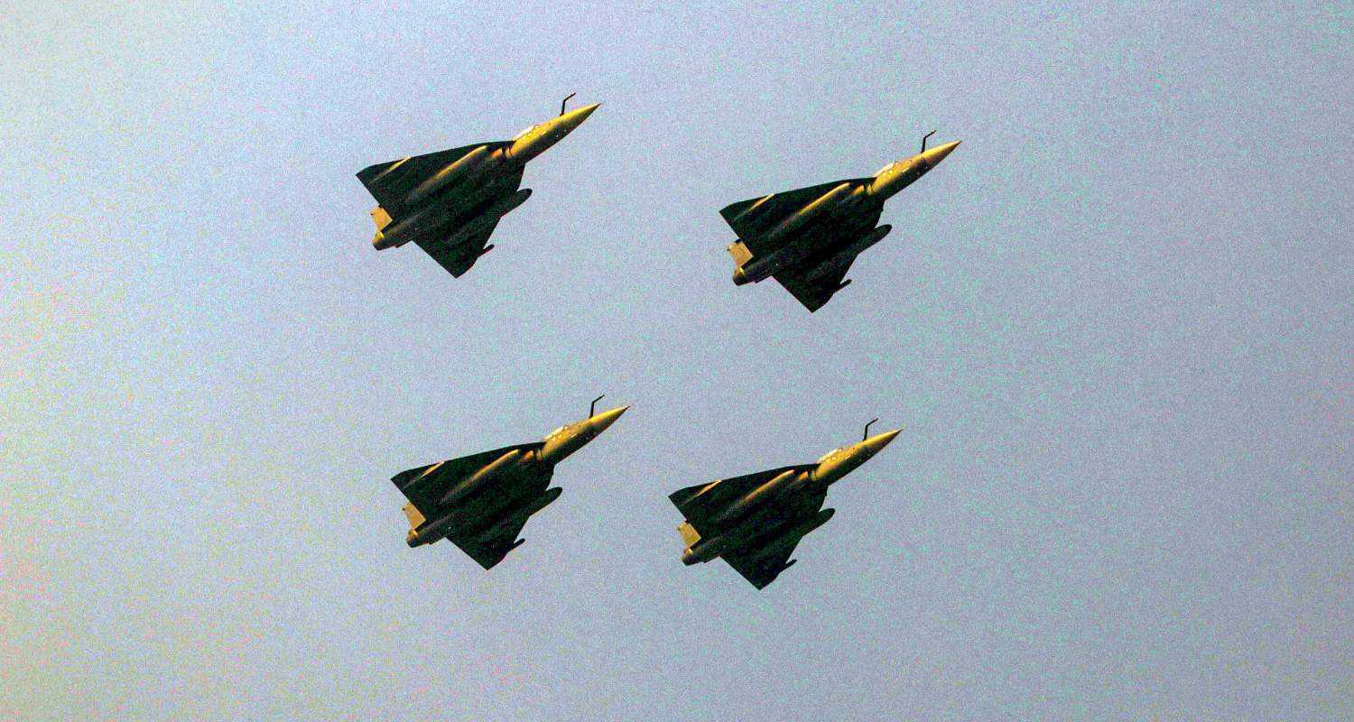 4 Tejas aircraft flying in a closed formation.