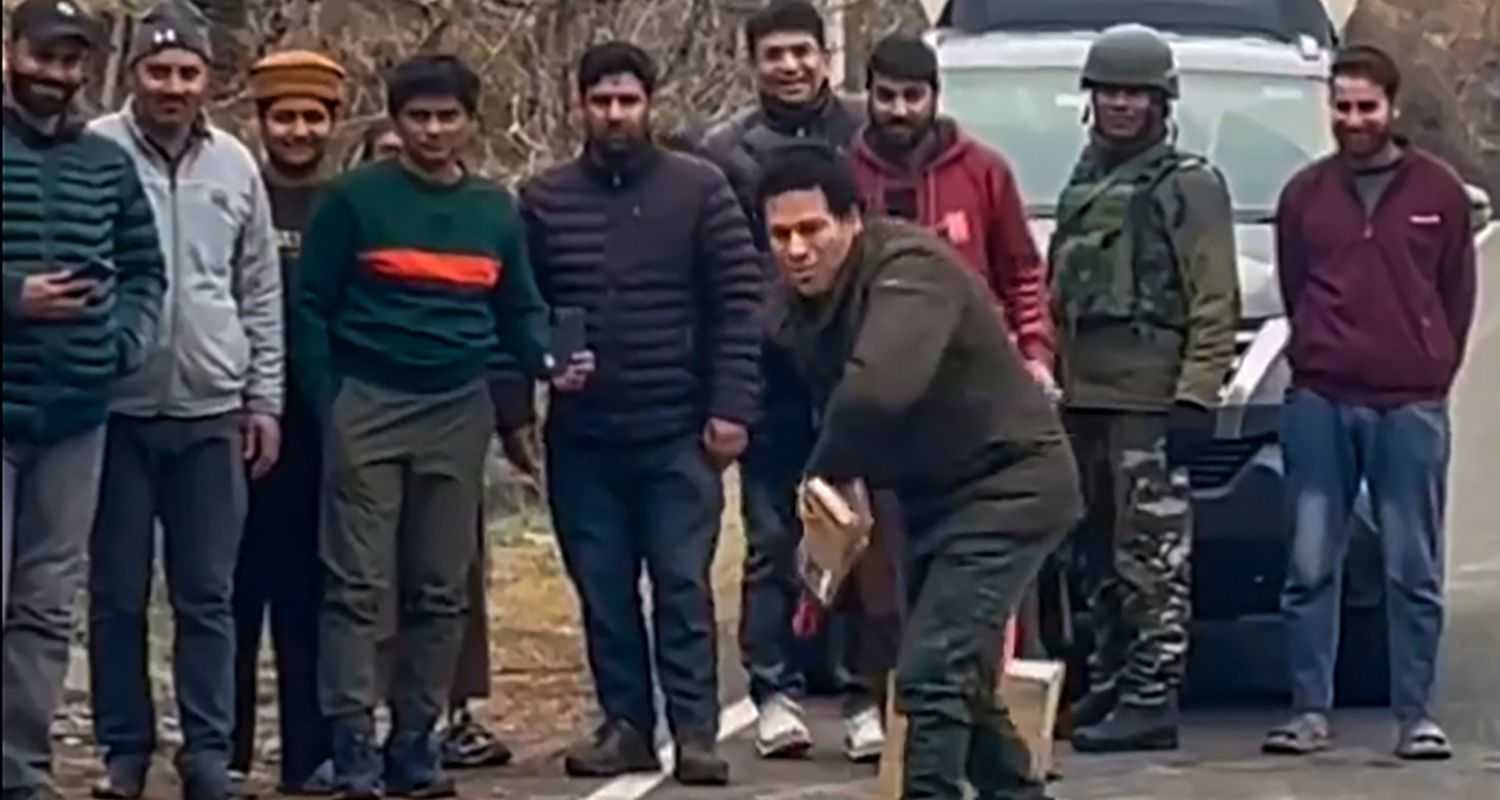 Sachin Tendulkar bats in a game of gully cricket with the locals at Uri, in Baramulla district on Thursday.