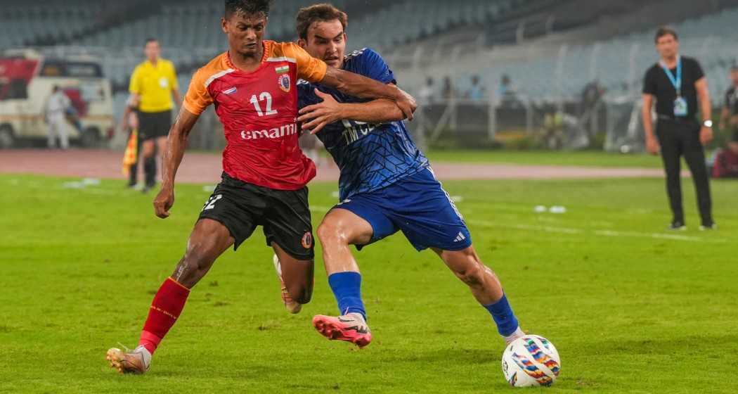 East Bengal FC and Altyn Asyr FC vie for the ball during their AFC Champions League 2 match at VYBK Stadium, in Kolkata, Wednesday, Aug. 14, 2024.