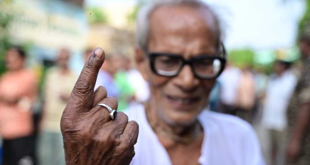 A senior elector proudly showcasing his inked finger after casting his vote in Phase 7 of the Lok Sabha Election at 109 Khardaha AC under 16 Dum Dum PC of North 24 Parganas district, West Bengal.