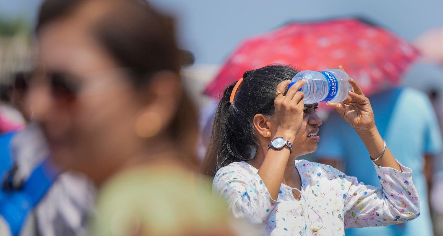 A woman holds a cold water bottle against her face amid the ongoing heatwave, April heatwave in South Asia made 45 times more likely by climate crisis: Scientists