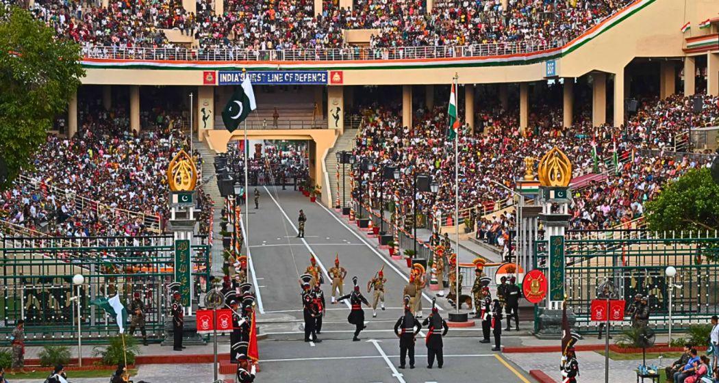 Indian BSF personnel and Pakistan Rangers take part in the Beating Retreat ceremony at the Wagah Border.