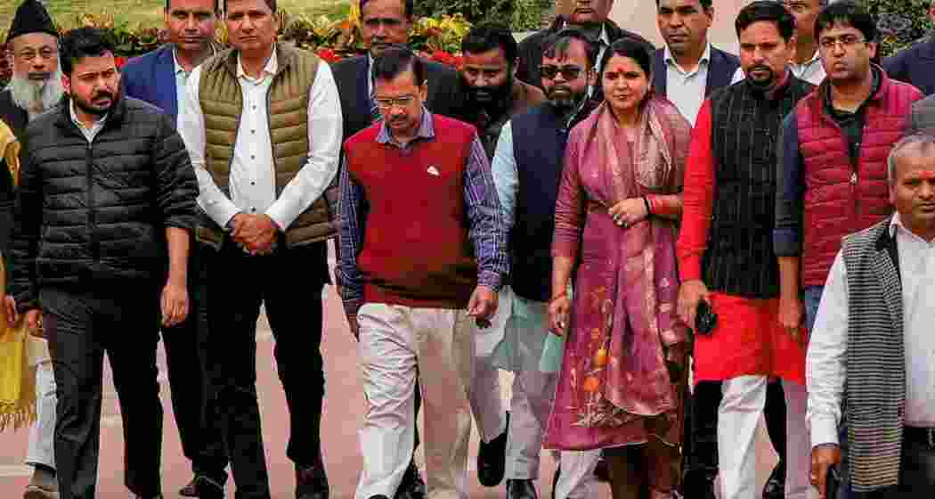 Delhi CM and AAP leader Arvind Kejriwal with cabinet ministers and party legislators leaves after visiting Rajghat to mark one year of party leader Manish Sisodia's arrest, in Delhi on Monday.