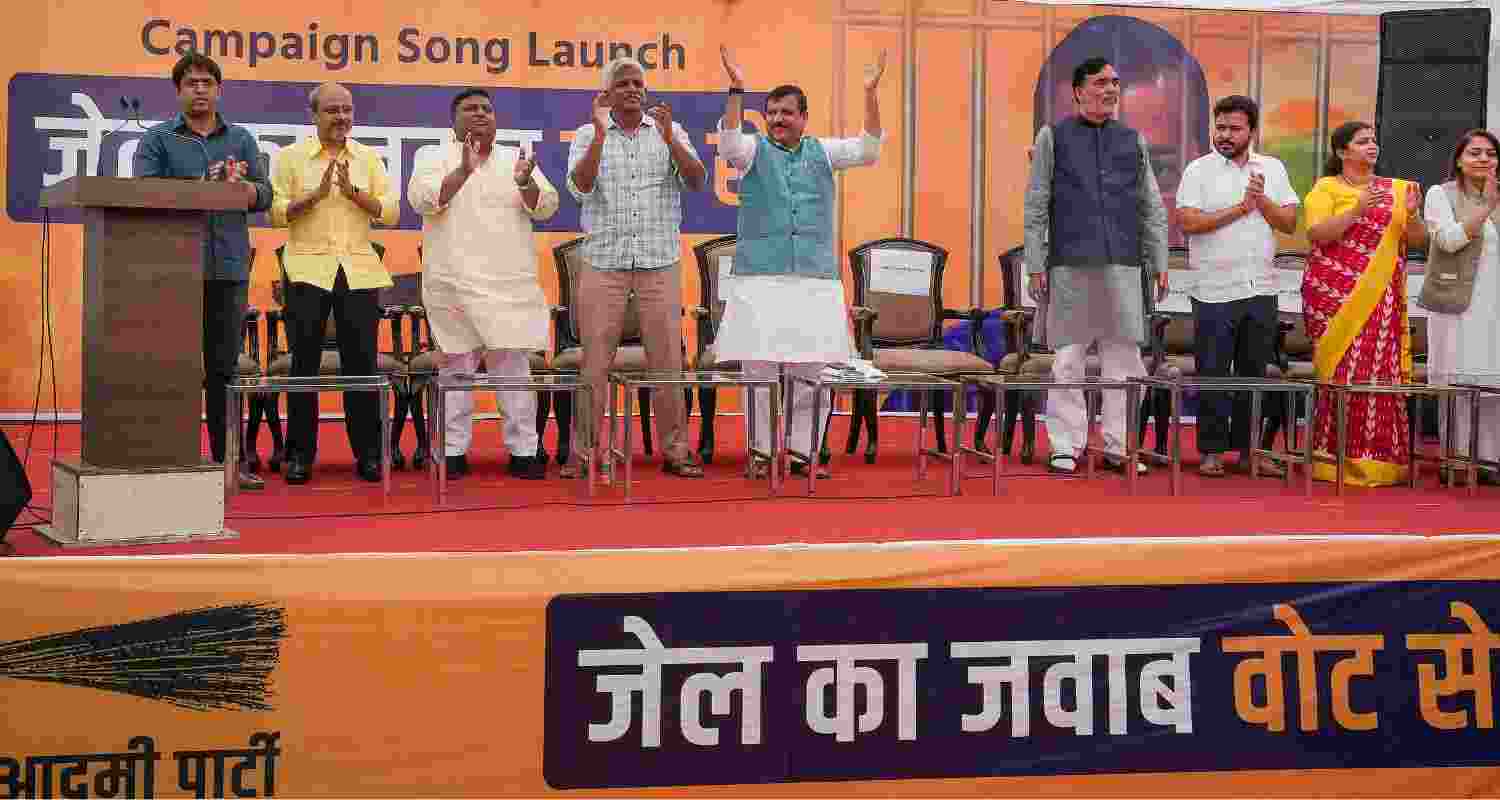 AAP leaders Sanjay Singh and Gopal Rai with others at the party's campaign song launch. 