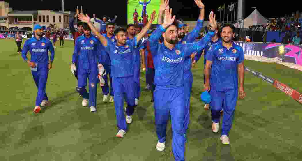 Afghanistan's captain Rashid Khan with teammates acknowledges fans after Afghanistan won the ICC Men's T20 World Cup cricket match against Bangladesh, at Arnos Vale Ground, Kingstown, Saint Vincent and the Grenadines, Monday, June 24, 2024.