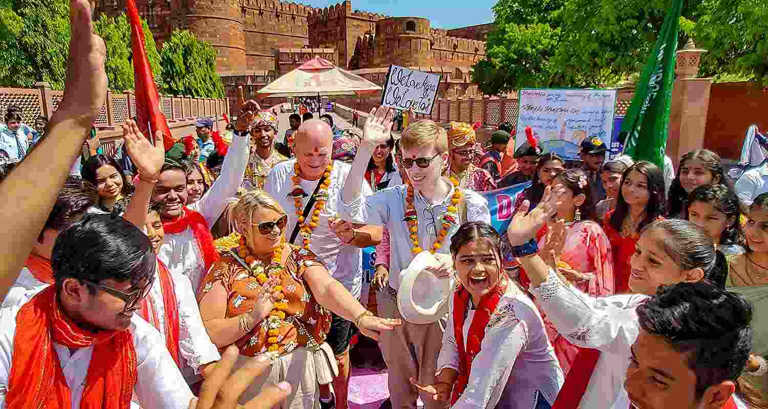 Foreign tourists during celebrations of World Heritage Day at the Agra Fort