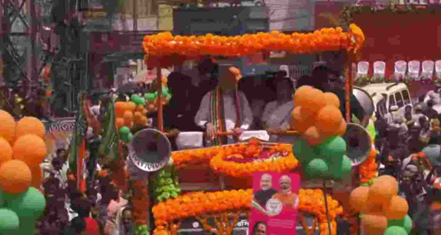 Amit Shah addresses a roadshow in Malda