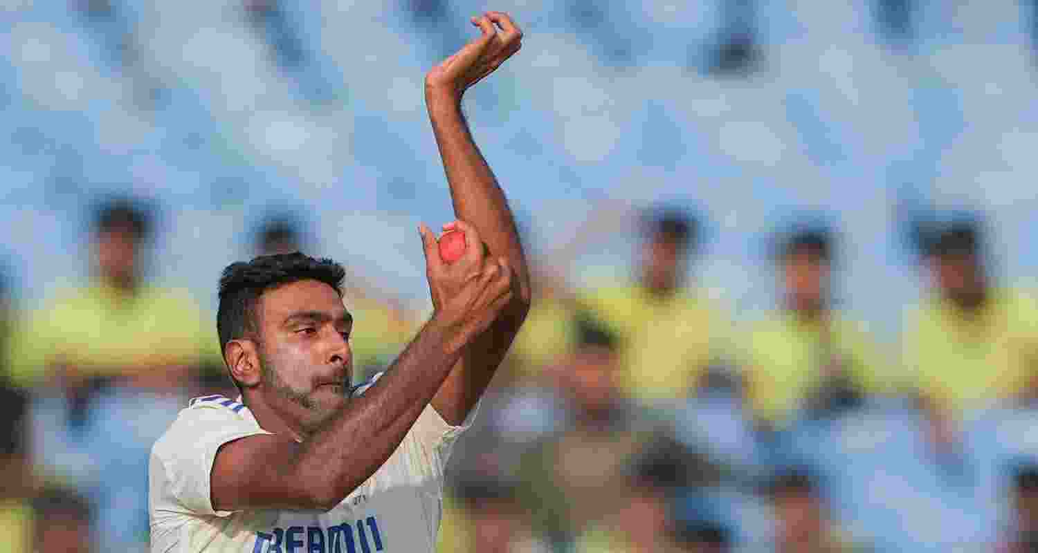 Ravichandran Ashwin bowls a delivery in the test match against England in Rajkot, Gujarat.