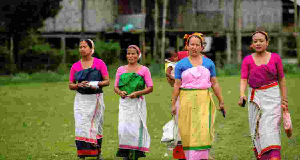 Women in Assam arrive to cast their vote during the first round of polling of India's national election.