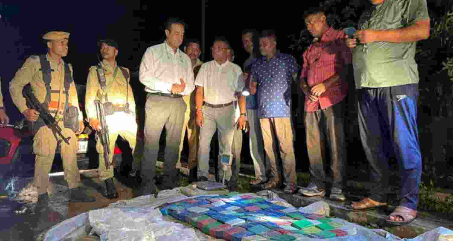 Law enforcement officials make a significant drug seizure after intercepting a vehicle in Silchar, Assam on Thursday.