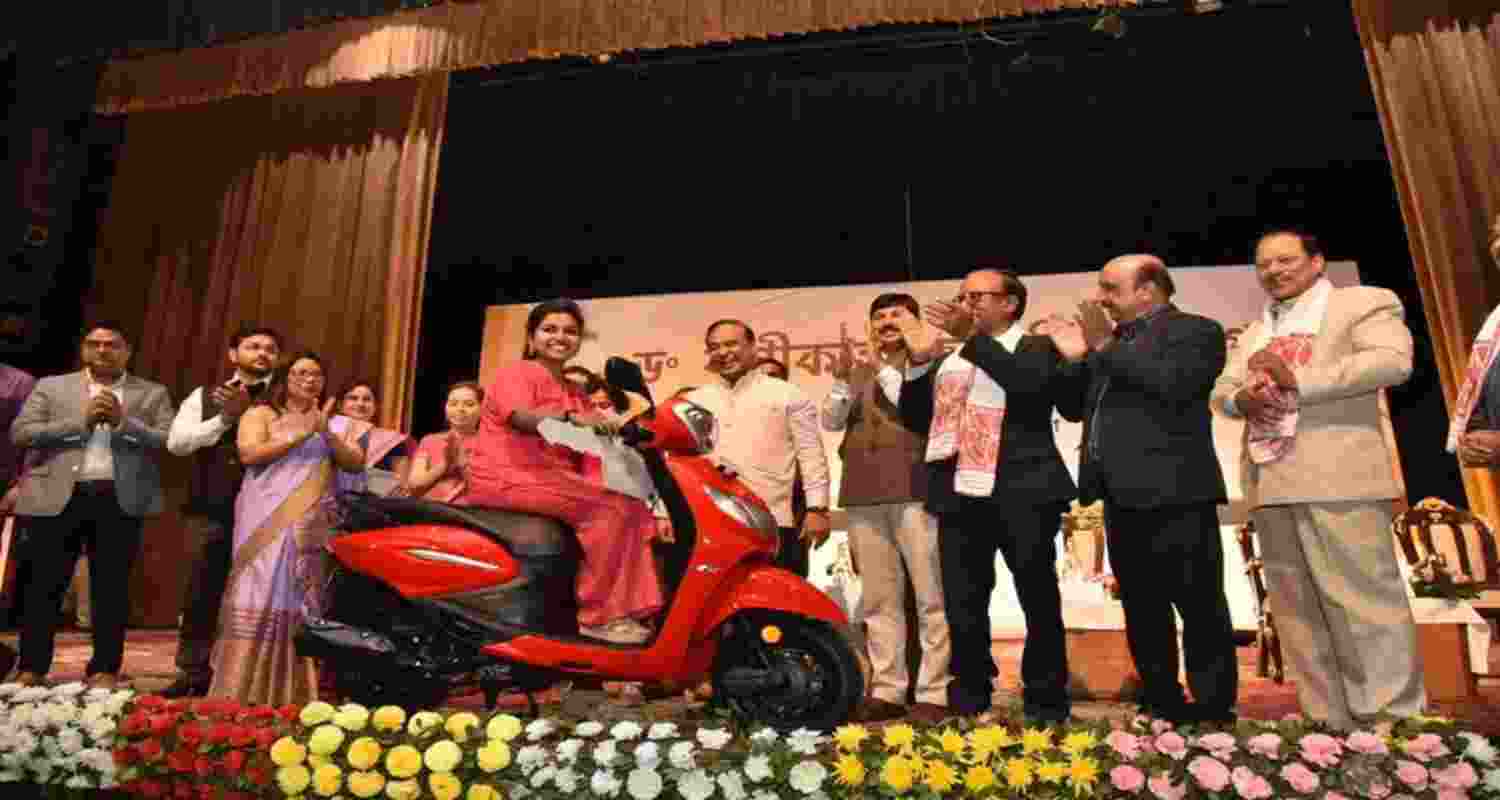 CM Himanta Biswa Sarma distributes scooters to over 15,160 girl students as part of the Dr. Banikanta Merit Award under Pragyan Bharati scheme in 2022.