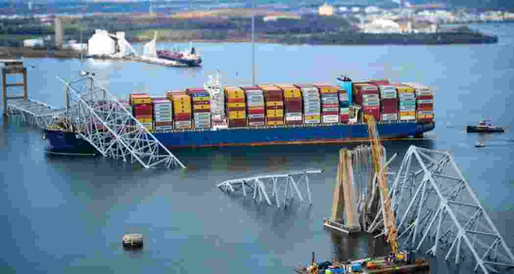 In an aerial view, the cargo ship Dali sits in the water after running into and collapsing the Francis Scott Key Bridge on March 26, 2024 in Baltimore in the U.S. state of Maryland.