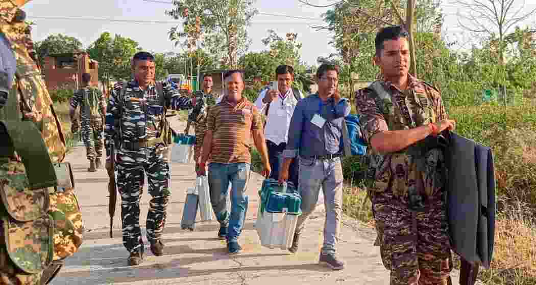  Polling officials and security personnel leave with election material from Imamganj after polling for the first phase of Lok Sabha elections, in Gaya district on Friday.