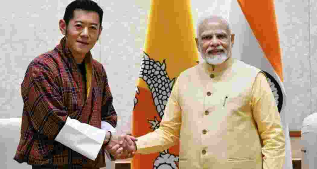Bhutan King Jigme Khesar Namgyel Wangchuck shakes hands with Prime Minister Narendra Modi