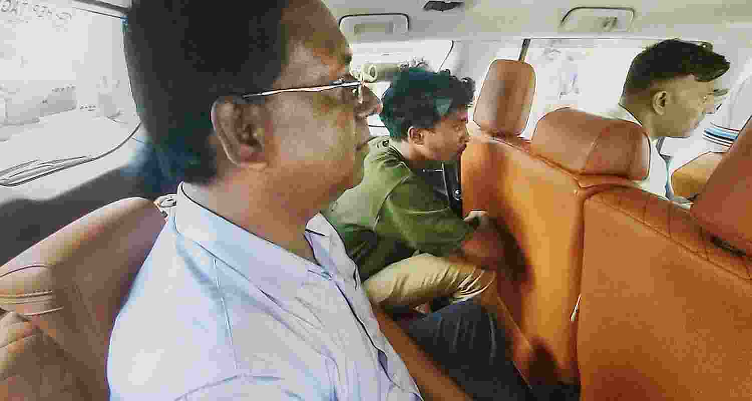  Oasis School Principal Ahsanul Haque being taken for questioning by CBI officials in connection with the alleged NEET paper leak, in Hazaribagh district of Jharkhand, Wednesday. 