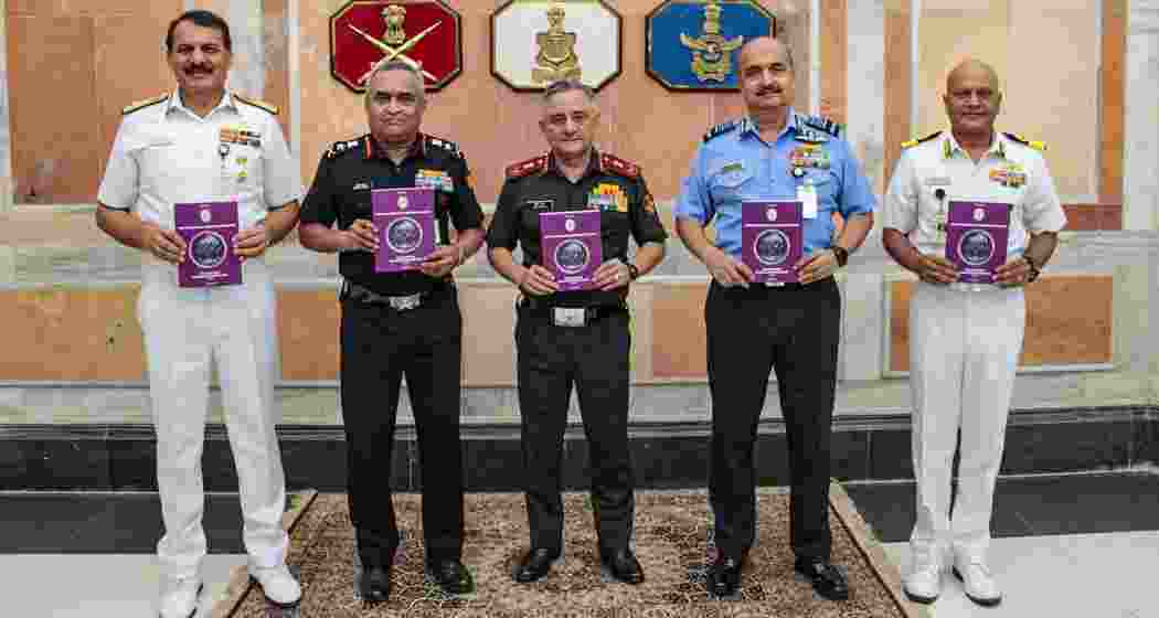 CDS Gen Anil Chauhan with Army Chief Gen Manoj Pande, IAF chief Air Chief Marshal VR Chaudhari and Navy Chief Admiral Dinesh Tripathi release the Joint Doctrine for Cyberspace Operations, in New Delhi.