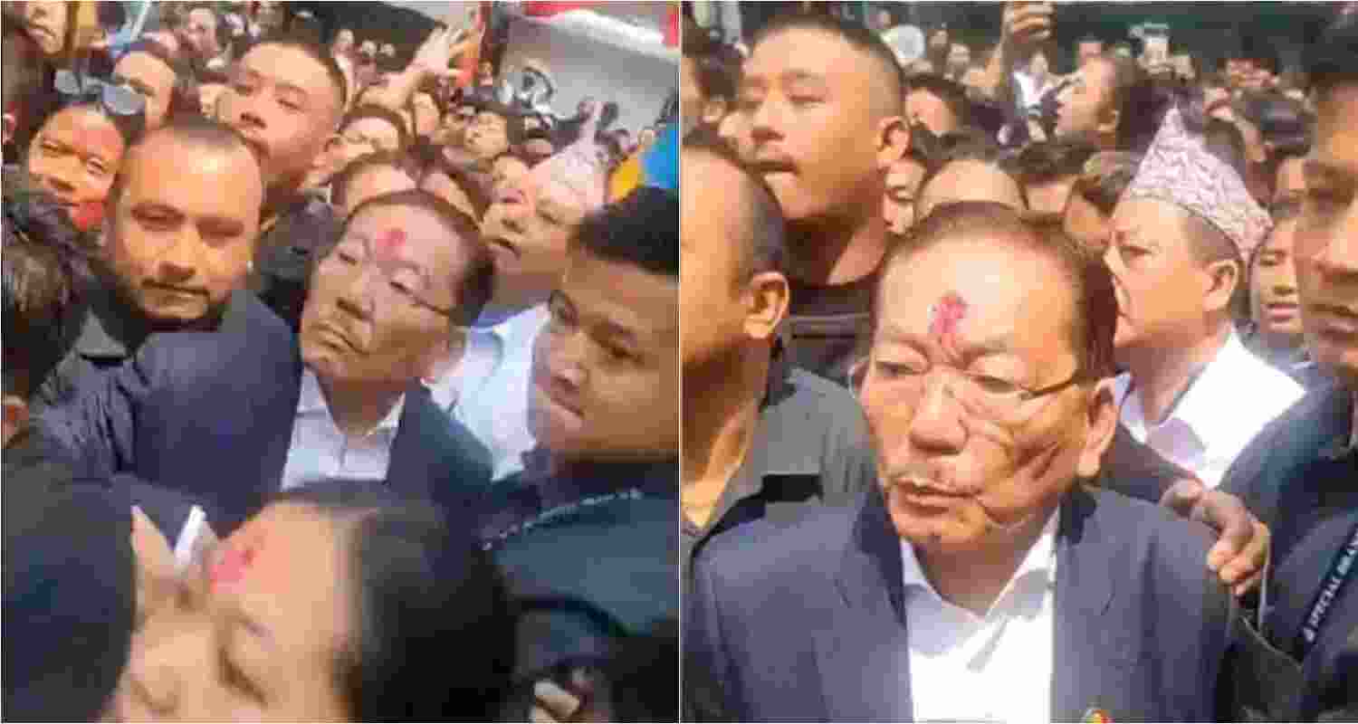 The picture depicts Chamling campaigning amid a crowd approaching the vicinity.