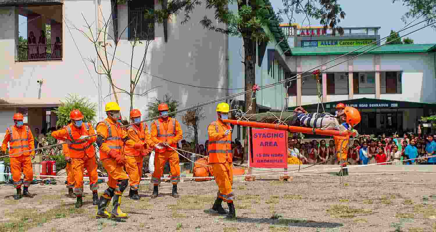 Personnel from the National Disaster Response Force (NDRF) and State Disaster Response Force (SDRF) conduct a mock drill, organised by the National Disaster Management Authority (NDMA), as part of preparations for the annual 'Char Dham Yatra', in Dehradun, Thursday