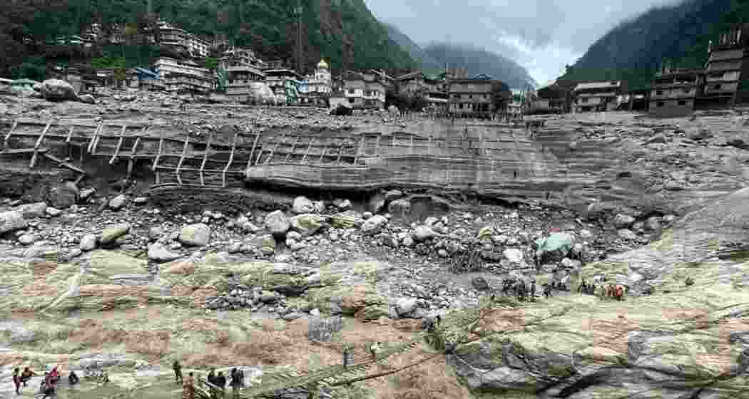 A temporary bamboo bridge being set up at Chungthang, where the Teesta III dam was swept away on October 4 causing severe damage to two NHPC hydro power projects: 510 MW Teesta-V and the under-construction 500 MW Teesta-VI — downstream.