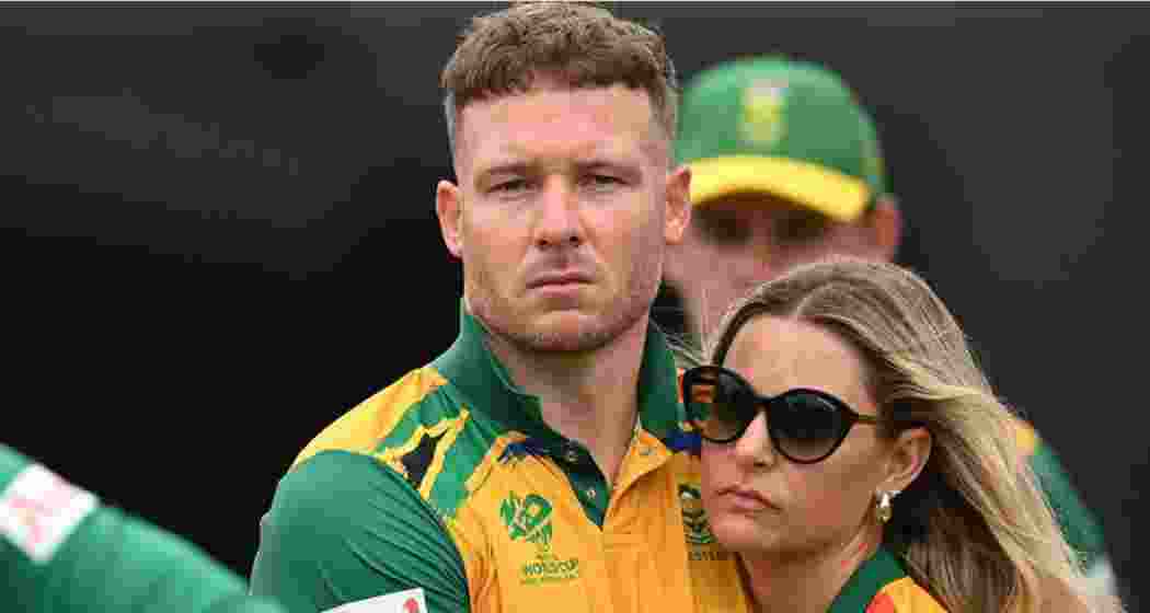 Camilla Harris (R), a professional polo player, consoles her husband, David Miller (L), after South Africa's heartbreaking seven-run defeat.
