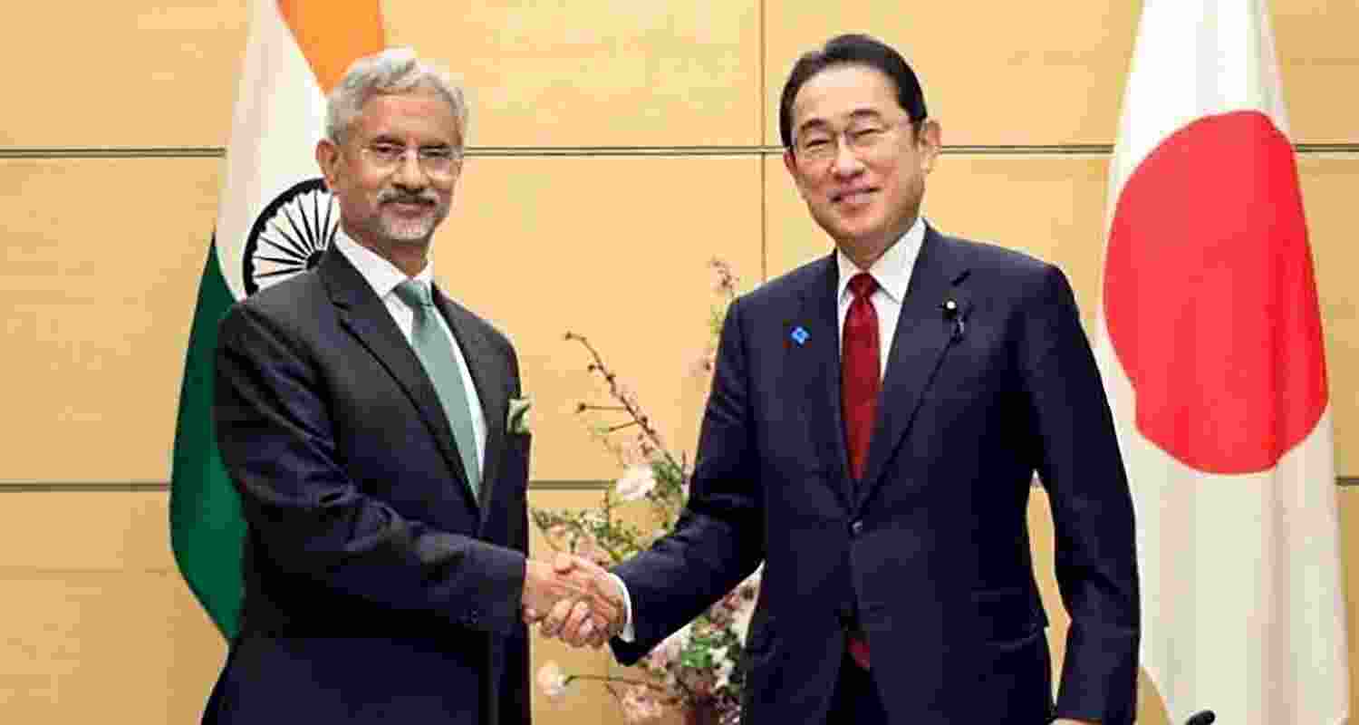 EAM S Jaishankar shaking hands with Japanese PM Fumio Kishida.