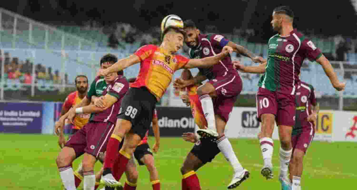 Mohun Bagan Super Giant and East Bengal FC players vie for the ball during their Durand Cup final football match, at Vivekananda Yuba Bharati Krirangan (VYBK), in Kolkata last year.