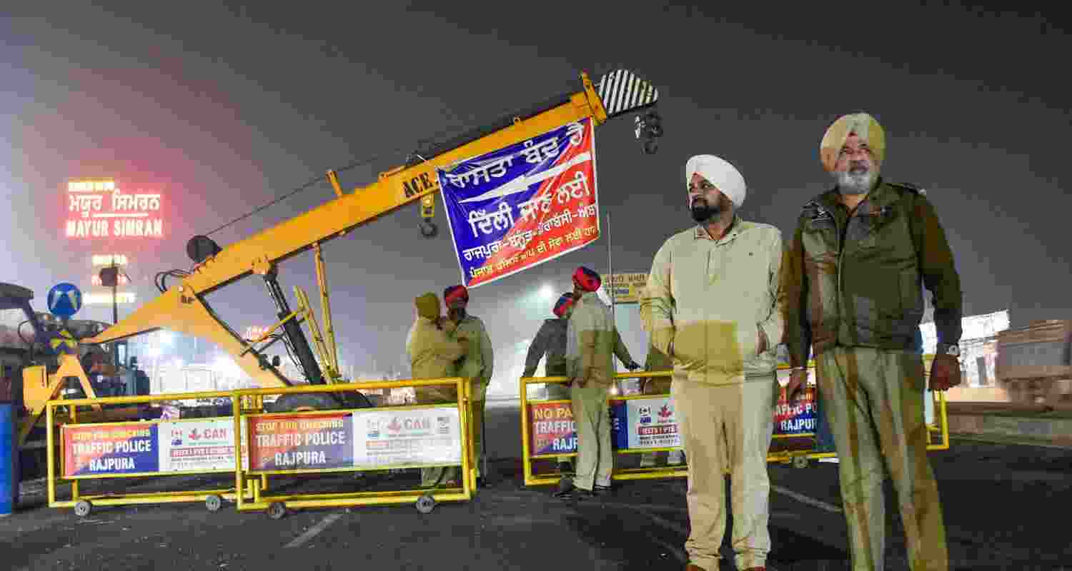 Policemen standing at the Punjab Haryana Chandigarh border to contain the protesting farmers.