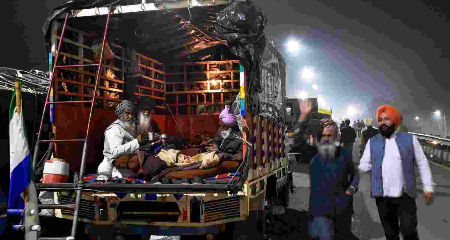  Farmers participating in protests at the Shambhu border, residing in the rear section of a truck.