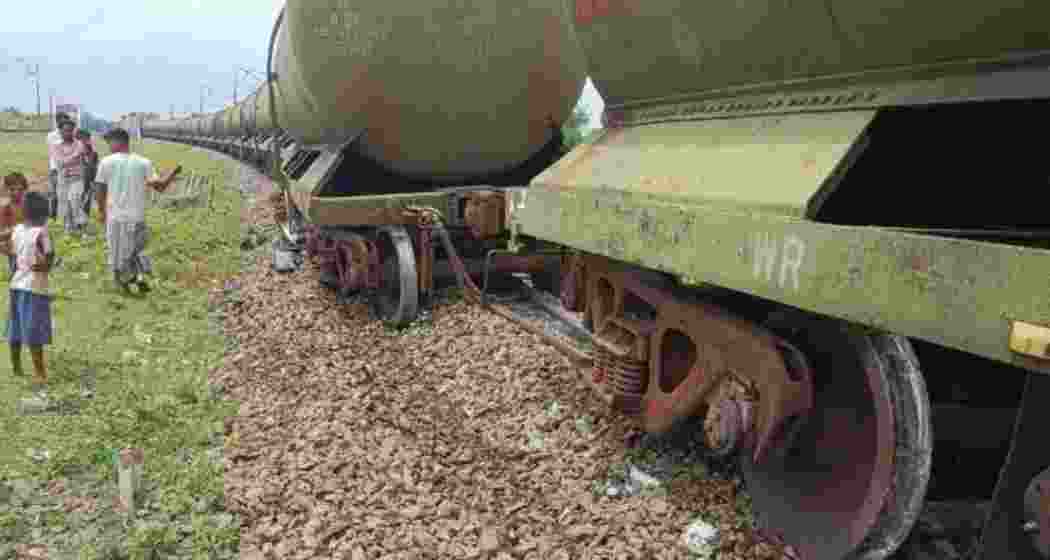 Scenes from the site of the goods train derailment near Kumedpur station in Malda district, where five petrol-laden wagons went off the tracks, disrupting traffic. 