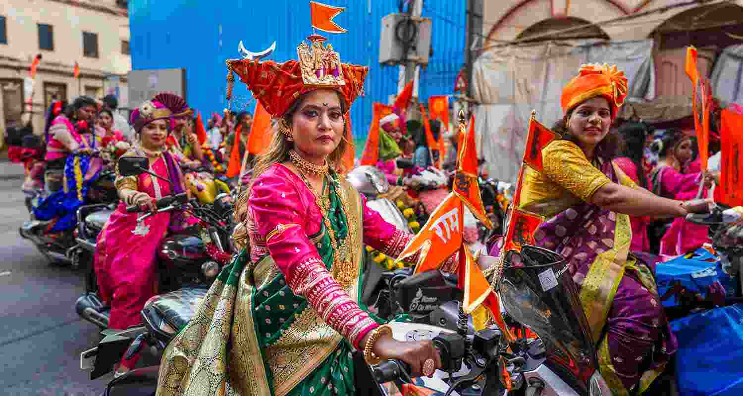 Women dressed in traditional attire participate in a rally on the occasion of ‘Gudi Padwa’