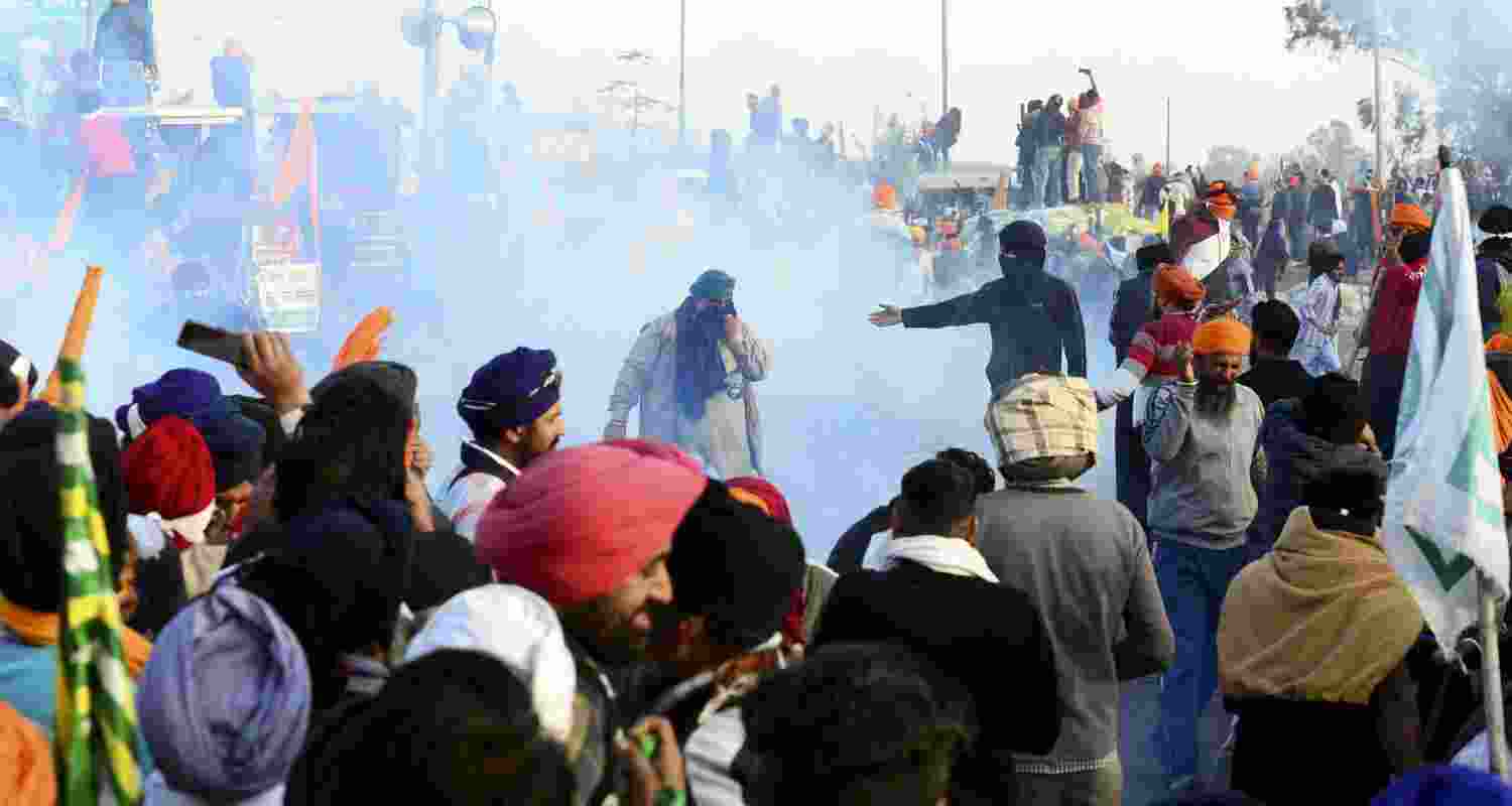 Police fire tear gas to disperse farmers during their 'Delhi Chalo' march, near the Punjab-Haryana Shambhu border, in Patiala distrct. 