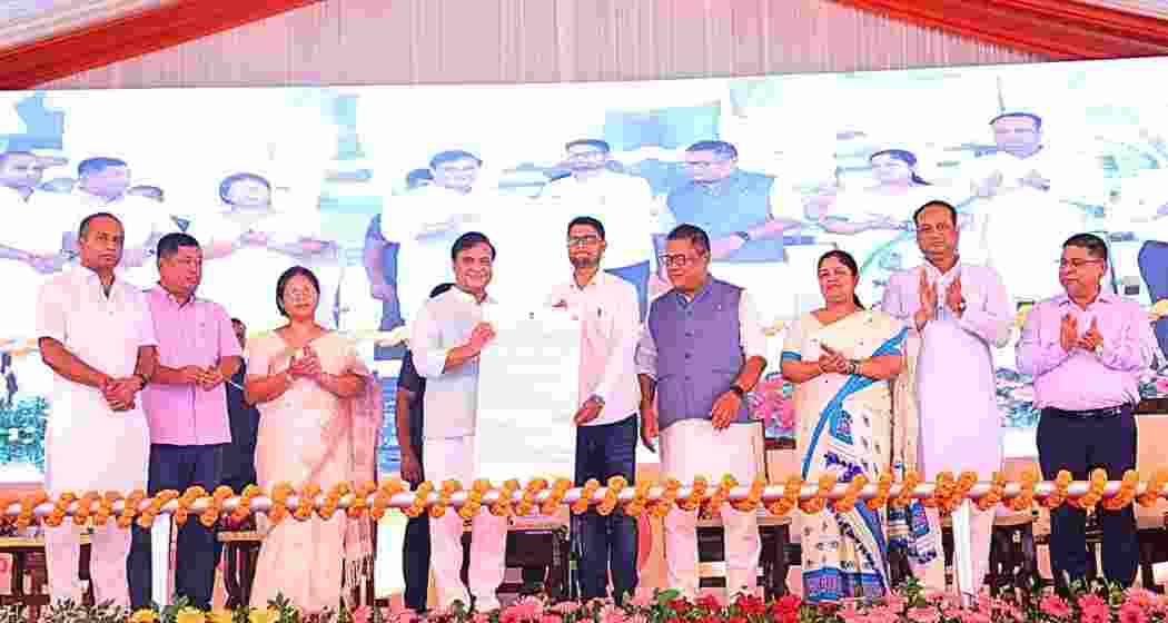 Assam CM Himanta Biswa Sarma hands out a job appointment letter to a newly recruited teacher at a public event in Guwahati. Permanent appointment letters were handed over to 23,956 other contractual and state pool teachers in the event.