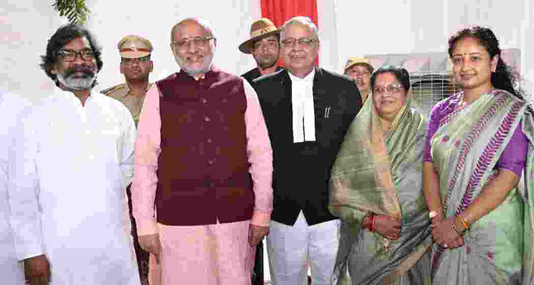 Jharkhand Chief Justice BR Sarangi along with Governor CP Radhakrishnan, Chief Minister Hemant Soren and others after swearing in ceremony at Raj Bhawan in Ranchi on Friday. 