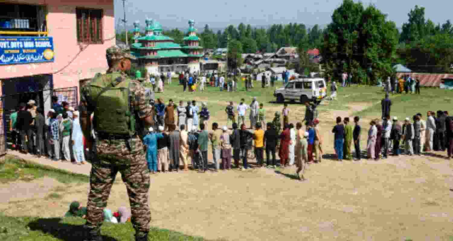 Voters wait to cast their votes during the 5th phase of Lok Sabha elections, in Budgam district of central Kashmir on Monday, May 20, 2024.