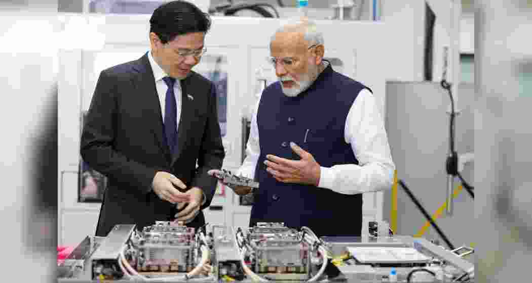 Prime Minister of Singapore, Lawrence Wong, and Indian Prime Minister Narendra Modi share a moment during their industrial visits in Singapore on Thursday, following their discussions on elevating bilateral relations to a Comprehensive Strategic Partnership.