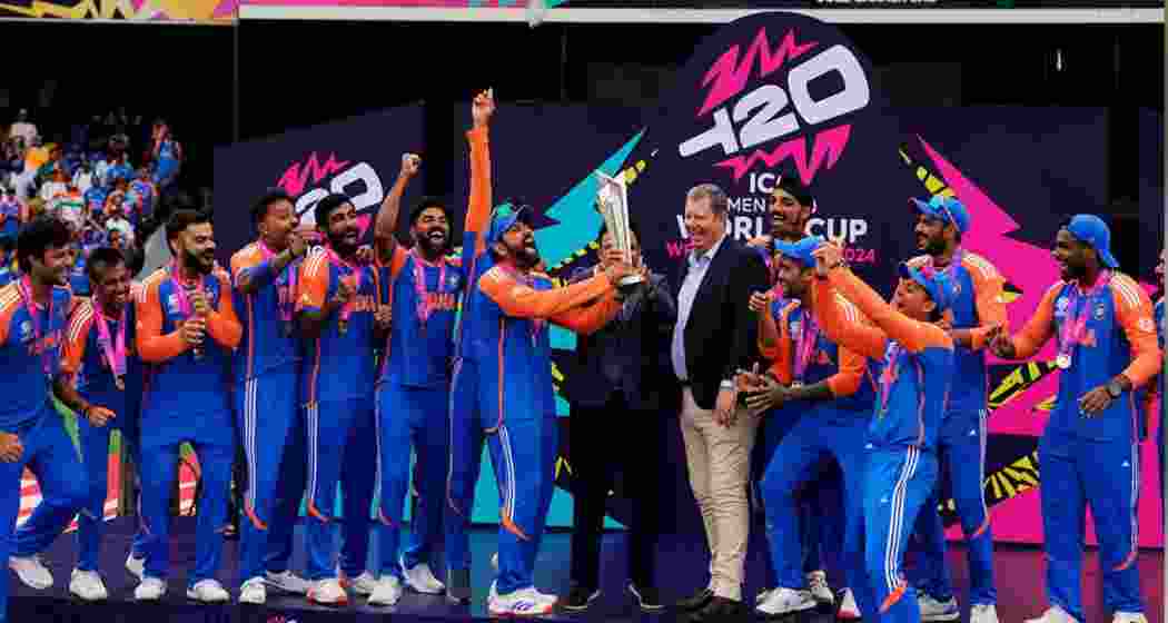 India's players lift the trophy after beating South Africa by 7 runs in the ICC Mens T20 World Cup 2024 final match, at Kensington Oval in Barbados on Saturday.