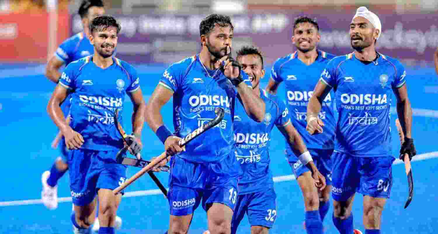 Indian men's hockey team captain Harmanpreet Singh celebrates with teammates after scoring a goal.