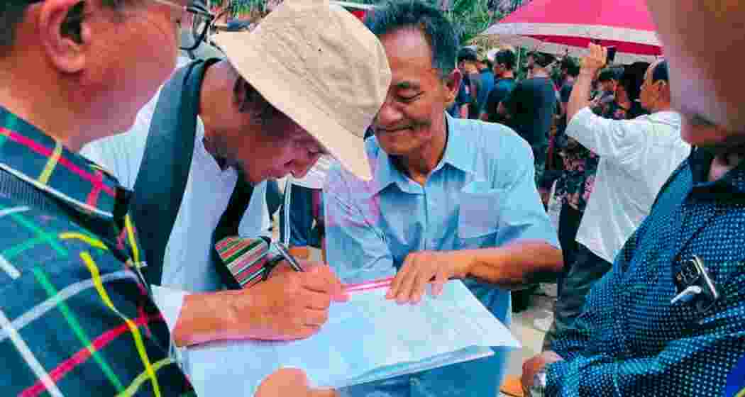 ITLF chairman Pagin Haokip signing a similar memorandum to be sent to Home Minister Amit Shah before submitting it to DC in June. File photo.