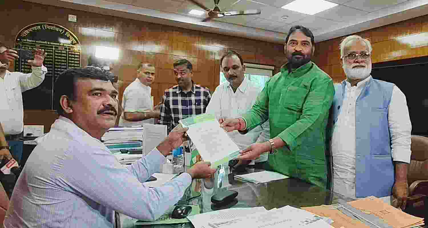 JMM General Secretary Vinod Pandey submits a memorandum to Chief Electoral Officer, Jharkhand, K Vijay Kumar in Ranchi on Wednesday.  