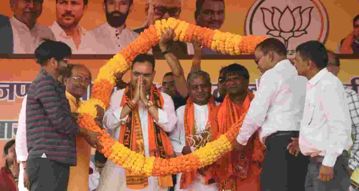 Rajasthan Chief Minister Bhajan Lal Sharma along with Jharkhand BJP president Babulal Marandi and Dhanbad Lok Sabha candidate Dhulu Mahto during a public meeting in Dhanbad, Jharkhand on Tuesday.