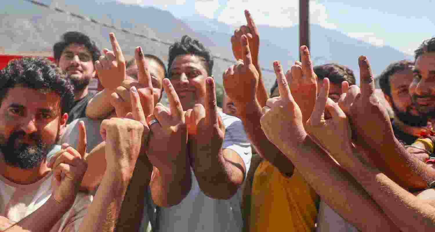 Voters show their fingers marked with indelible ink after Phase 1 of J&K polls.