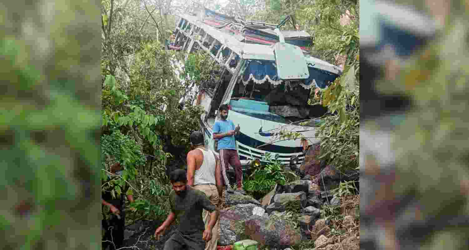 The damaged bus after it plunged into a gorge following an alleged attack by suspected terrorists, in Reasi district of Jammu and Kashmir, Sunday. 