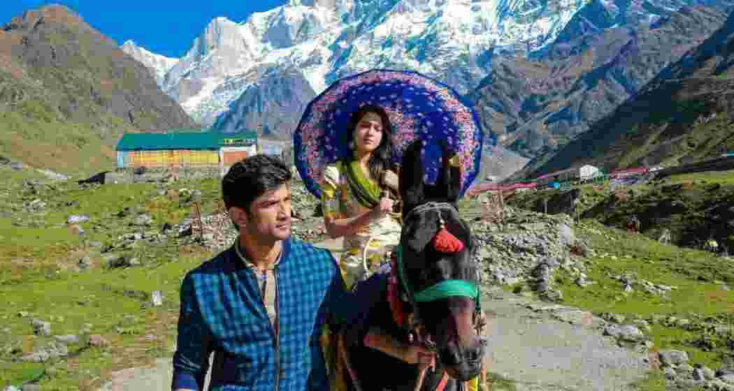 A scene from the movie Kedarnath featuring late actor Sushant Singh Rajput (L), and Sara Ali Khan (R).