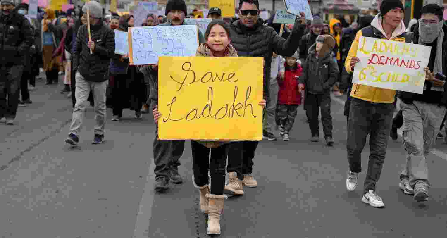 LS Polls: Ladakh demands Sixth schedule, statehood, employment A child holds up a placard at a Sixth schedule protest.