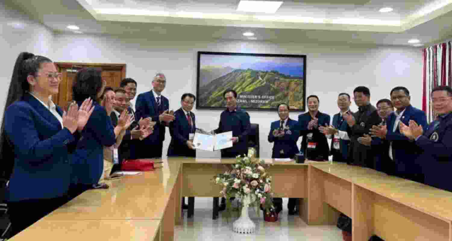 Representatives of Seoul's KUKKI-WON, the apex body of taekwondo, honoring CM Lalduhoma with an honorary black belt at his office in Aizawl on Friday.