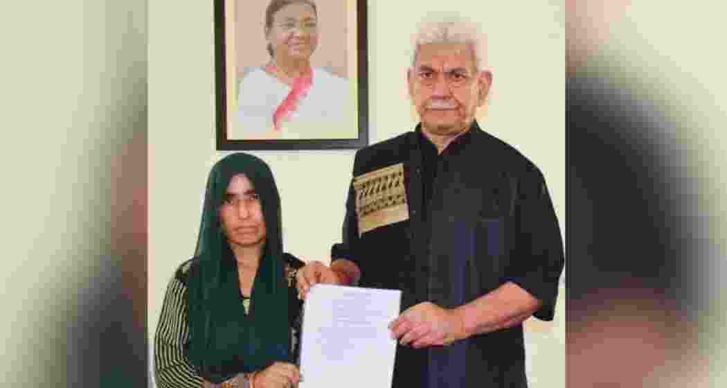 Lieutenant Governor Manoj Sinha presenting the appointment letter to Smt. Renu Sharma, the widow of Sh. Vijay Kumar, who was killed in the Reasi bus attack.