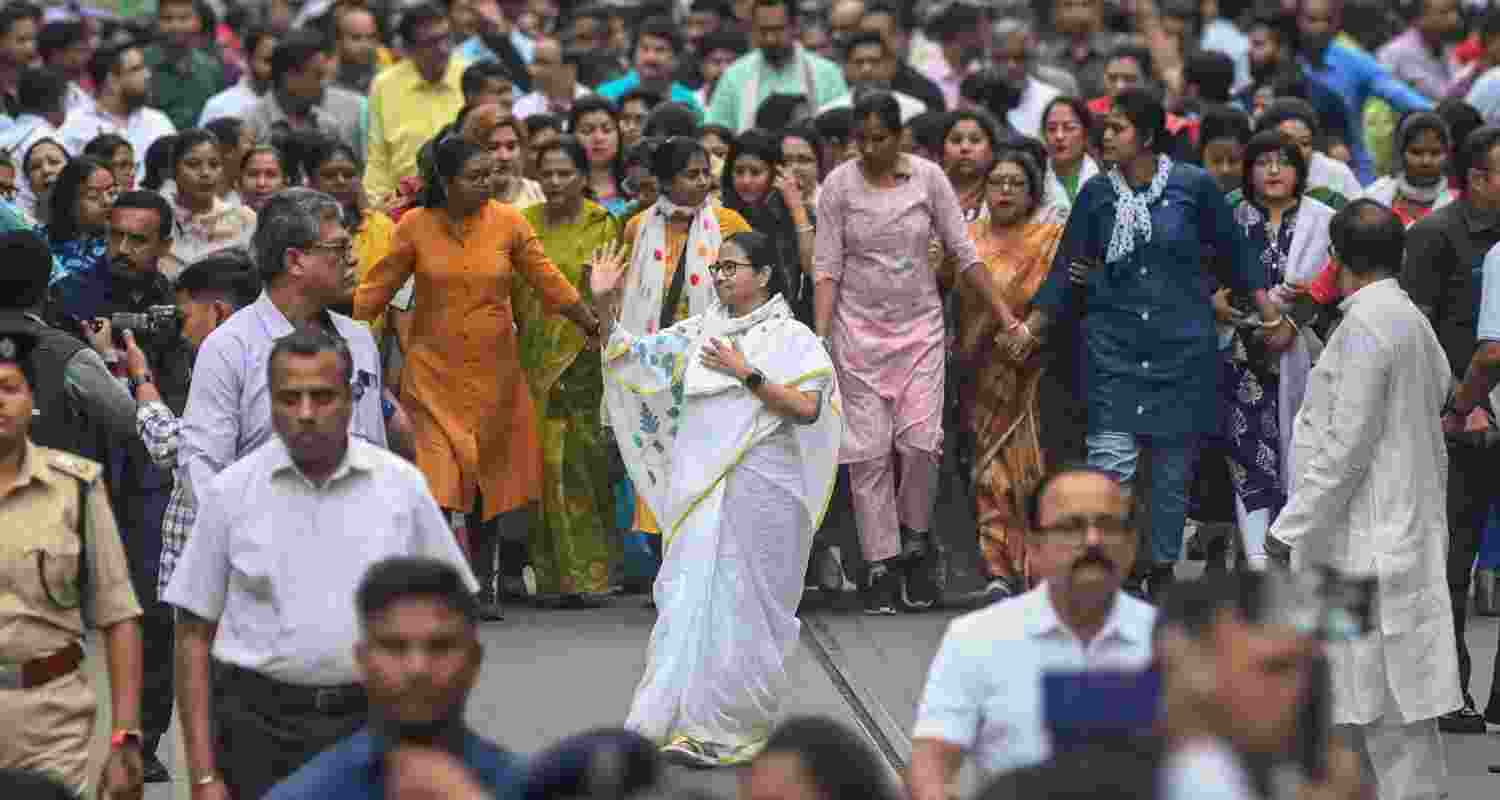 West Bengal CM and TMC supremo Mamata Banerjee participates in a rally on the eve of International Women's Day, in Kolkata, along with women participants.