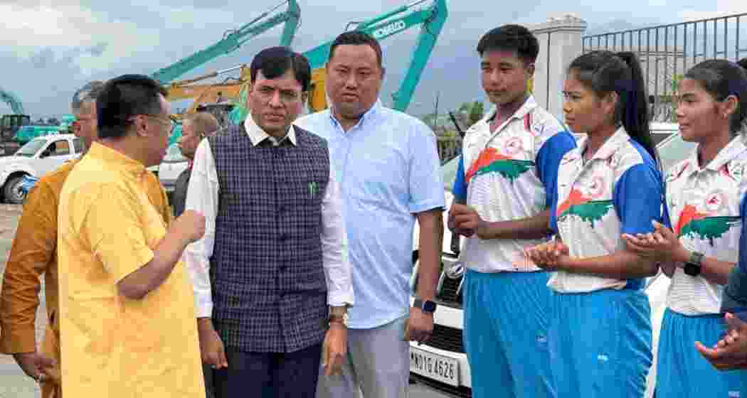 Union Minister Mansukh Mandaviya interacts with young athletes and state sports officials at the Regional Water Sports Complex in Takmu, Manipur, during his visit to discuss upgrades to sports infrastructure and support for local talent.