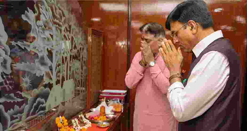 Union Minister Mansukh Mandaviya offers prayers before taking charge as Minister of Labour and Employment, in New Delhi.